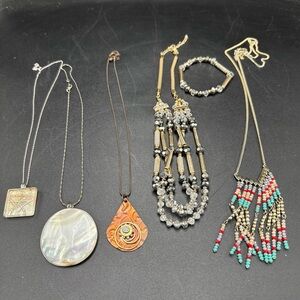 Lot of Assorted Costume Jewelry including Several Necklaces and a Bracelet
